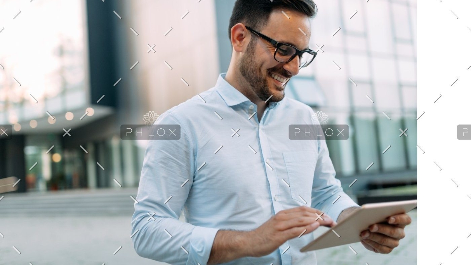 demo-attachment-815-portrait-of-businessman-in-glasses-holding-tablet-AWVHCJU